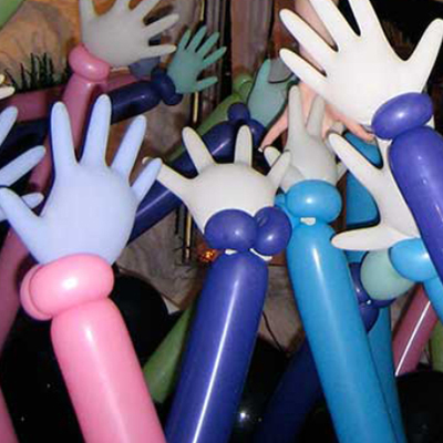 Crowded bunch of extended balloon arms with hands.